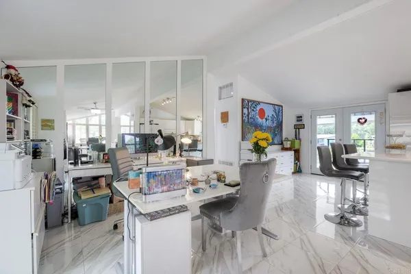 a view of a living room and dining room
