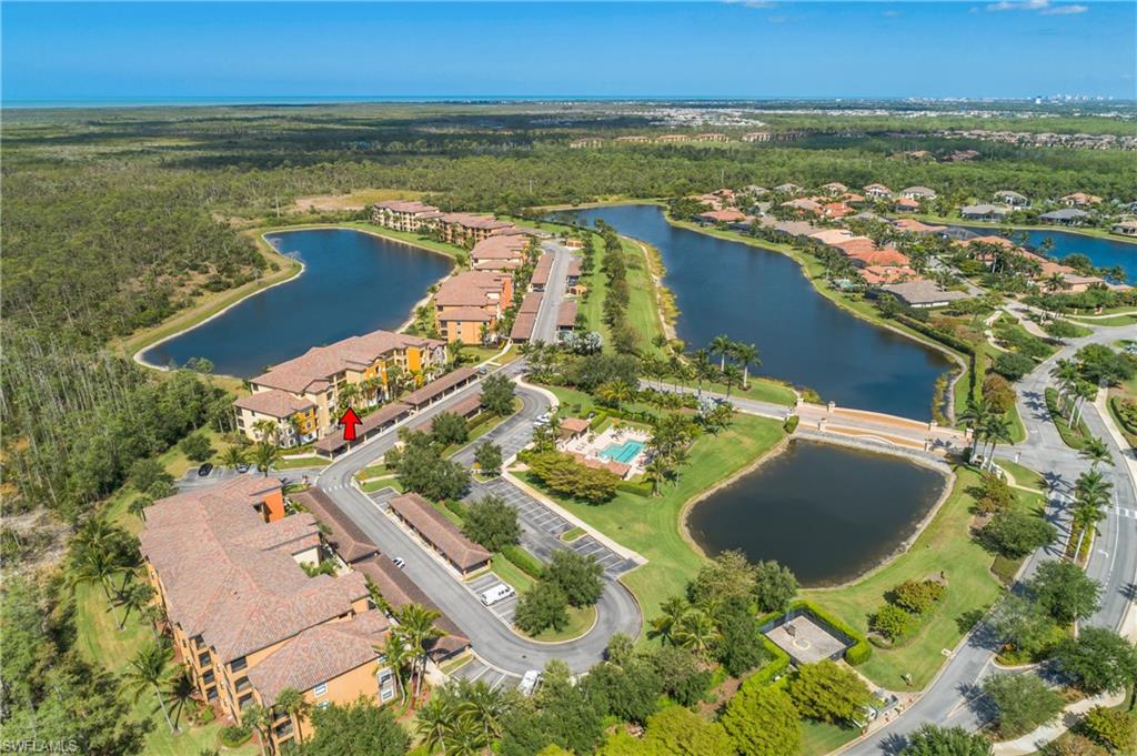 9719 Acqua Court, Unit 214 Naples, FL 34113 - Photo 28 of 50 an aerial view of residential houses with outdoor space