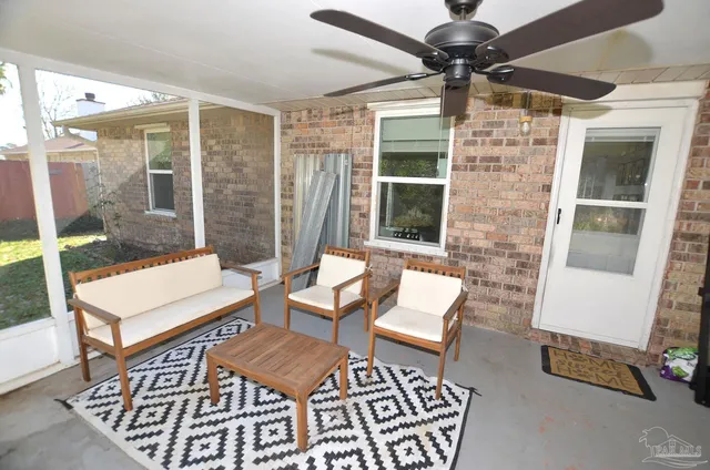 a view of a livingroom with furniture and a table