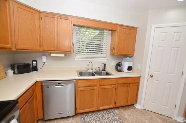 a kitchen with a cabinets and window