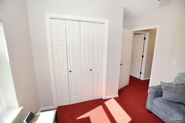 a bedroom with furniture and wooden floor