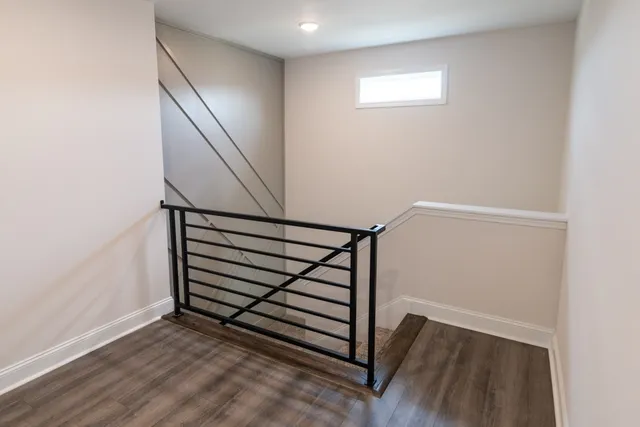 a view of entryway with stairs and wooden floor