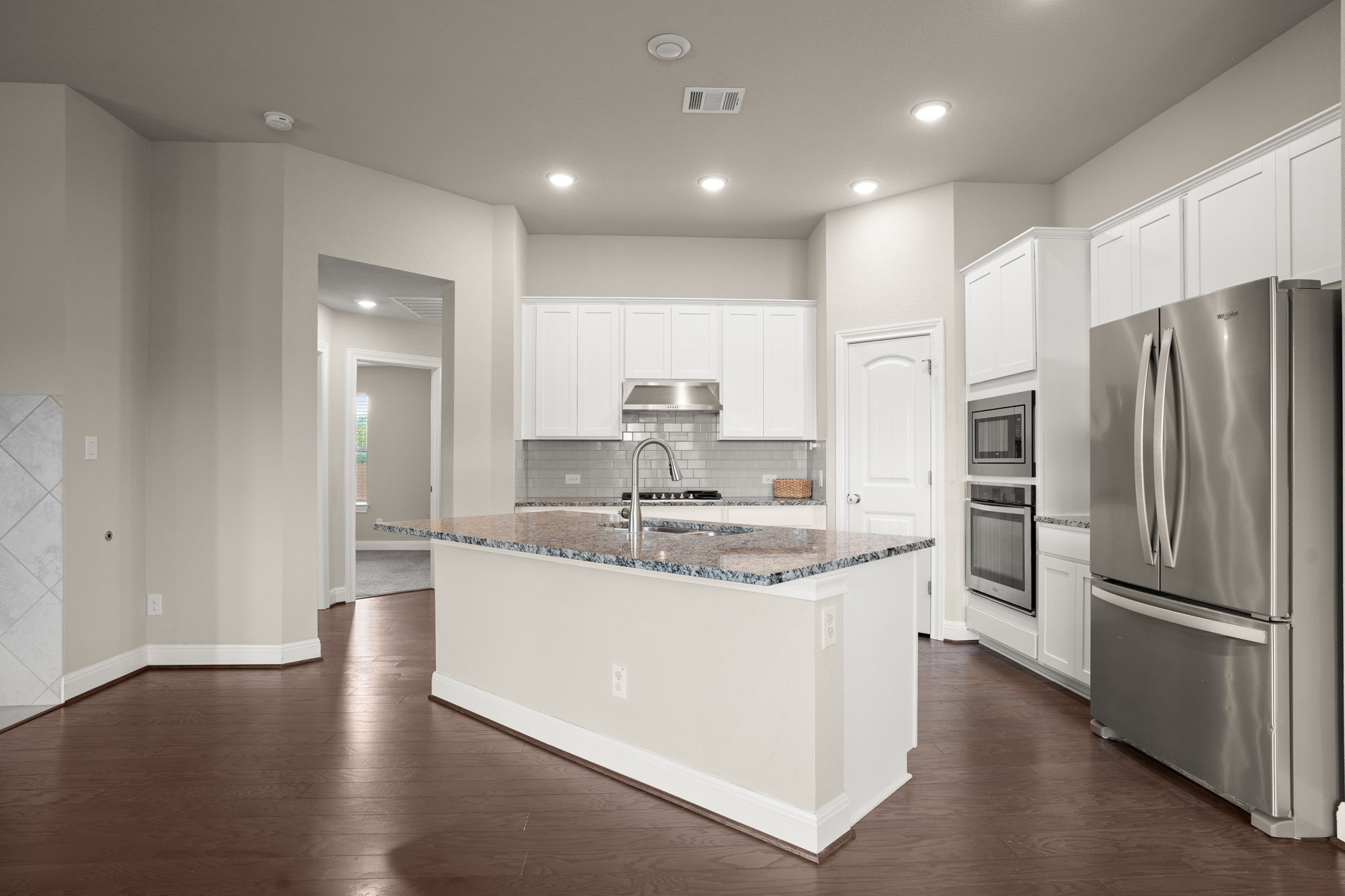 2209 Hat Bender Loop Round Rock, TX 78664 - Photo 5 of 25 a kitchen with stainless steel appliances granite countertop a sink and a refrigerator