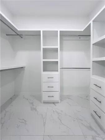 a view of an empty walk in closet