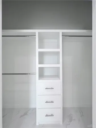 a view of an empty walk in closet
