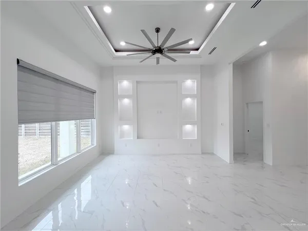 a view of an empty room with a window