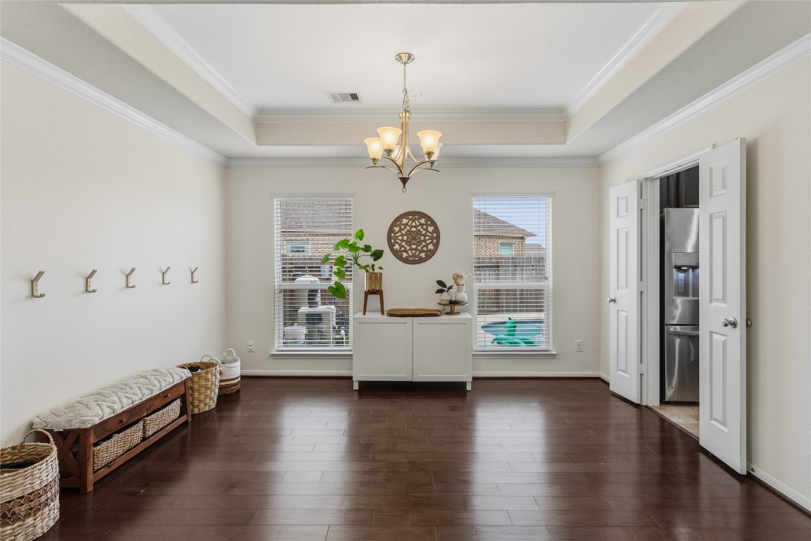 12402 Garnet Road Mont Belvieu, TX 77535 - Photo 14 of 49 an entryway with wooden floor and a window