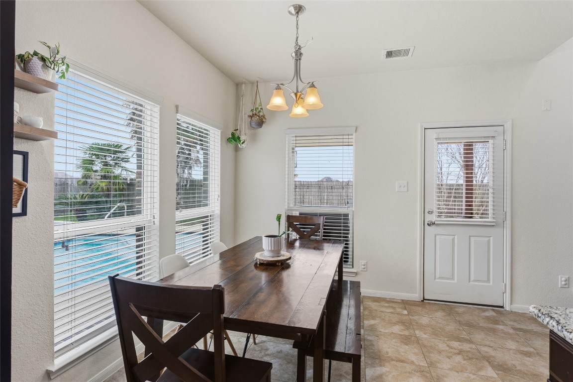12402 Garnet Road Mont Belvieu, TX 77535 - Photo 15 of 49 a view of a dining room with furniture window and outside view