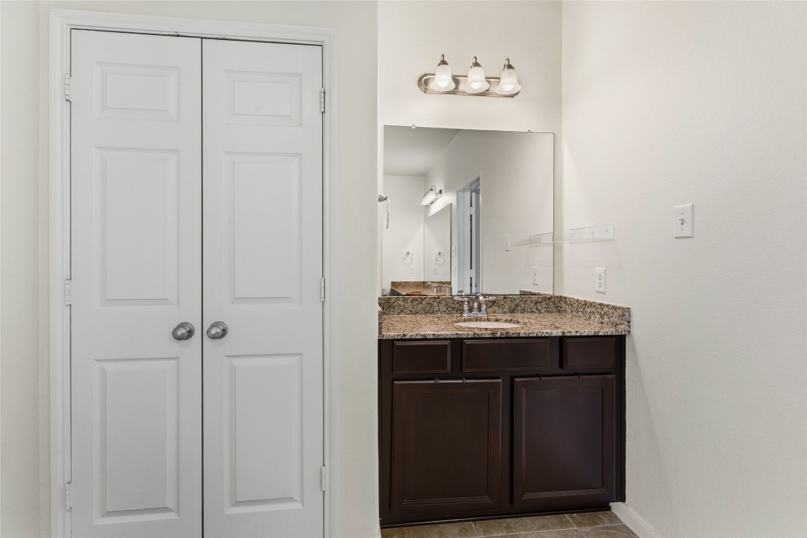 12402 Garnet Road Mont Belvieu, TX 77535 - Photo 20 of 49 a room with a sink and a mirror