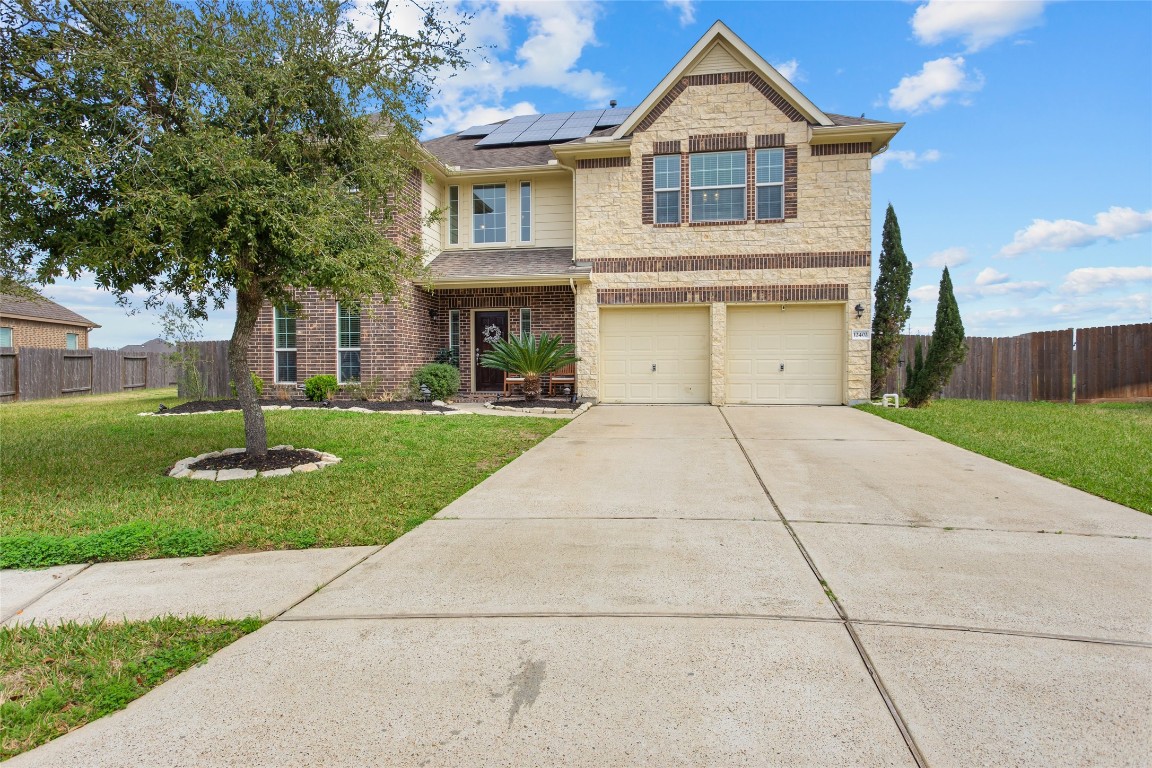12402 Garnet Road Mont Belvieu, TX 77535 - Photo 2 of 49 a front view of house with yard
