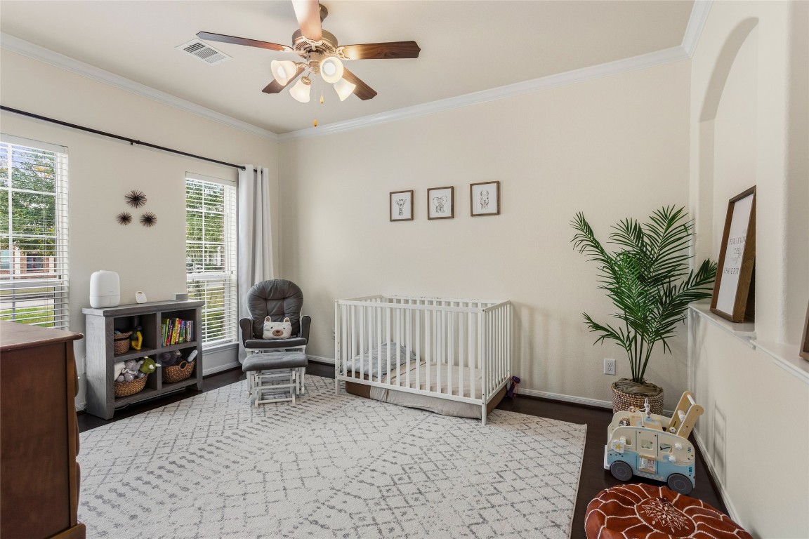 12402 Garnet Road Mont Belvieu, TX 77535 - Photo 22 of 49 a living room with furniture and a fireplace