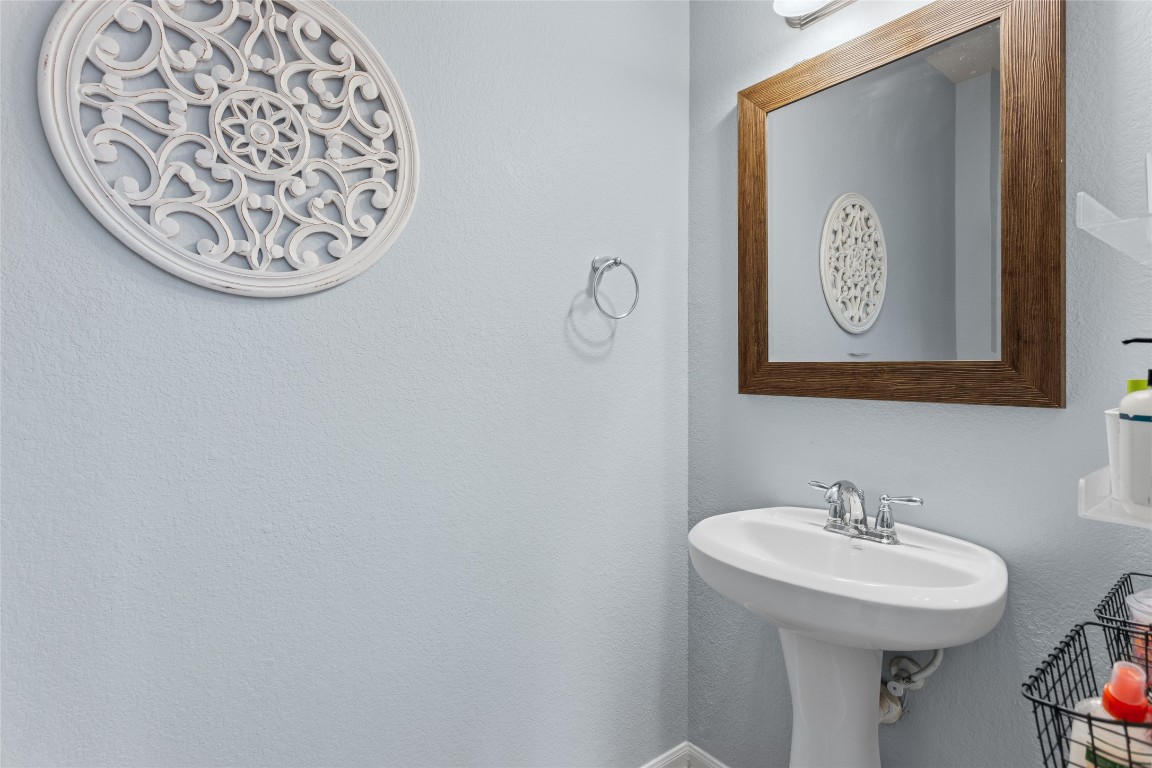 12402 Garnet Road Mont Belvieu, TX 77535 - Photo 23 of 49 a bathroom with a sink and a mirror