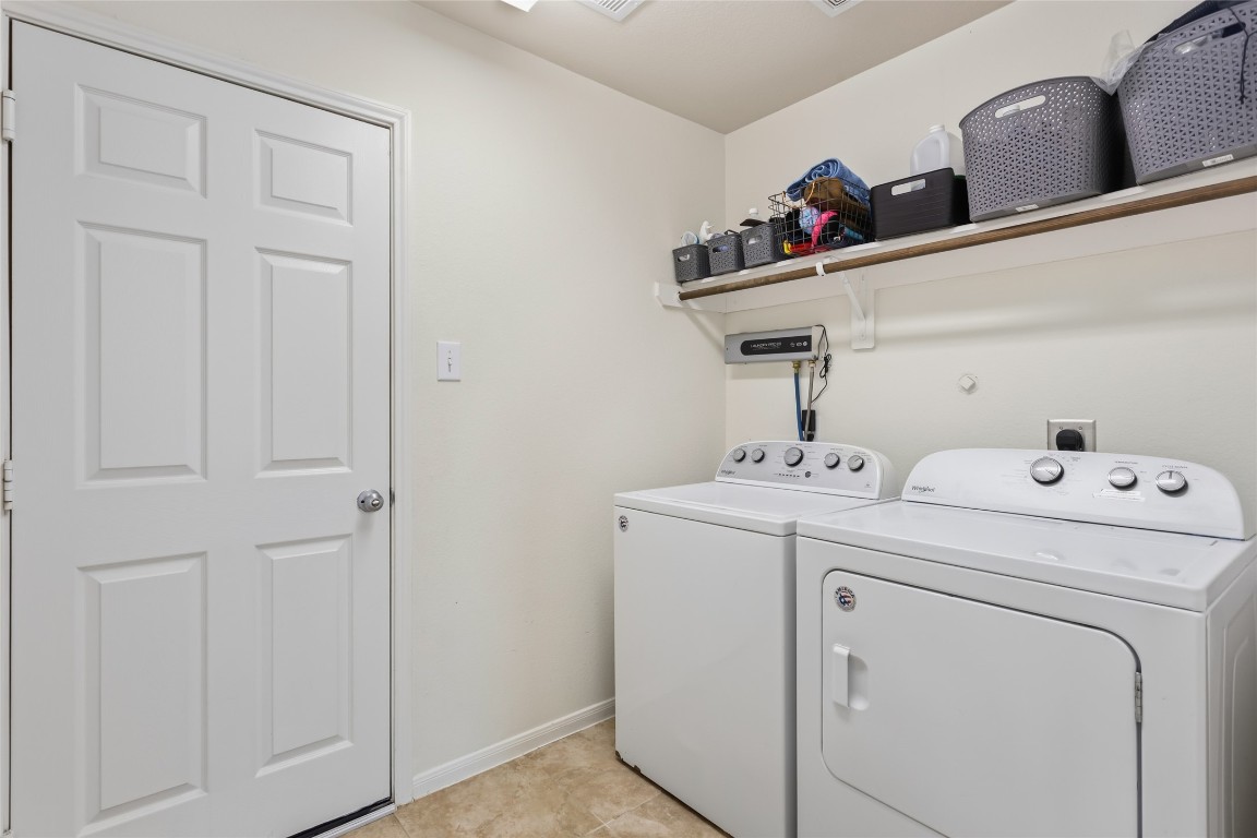 12402 Garnet Road Mont Belvieu, TX 77535 - Photo 24 of 49 a utility room with dryer and washer