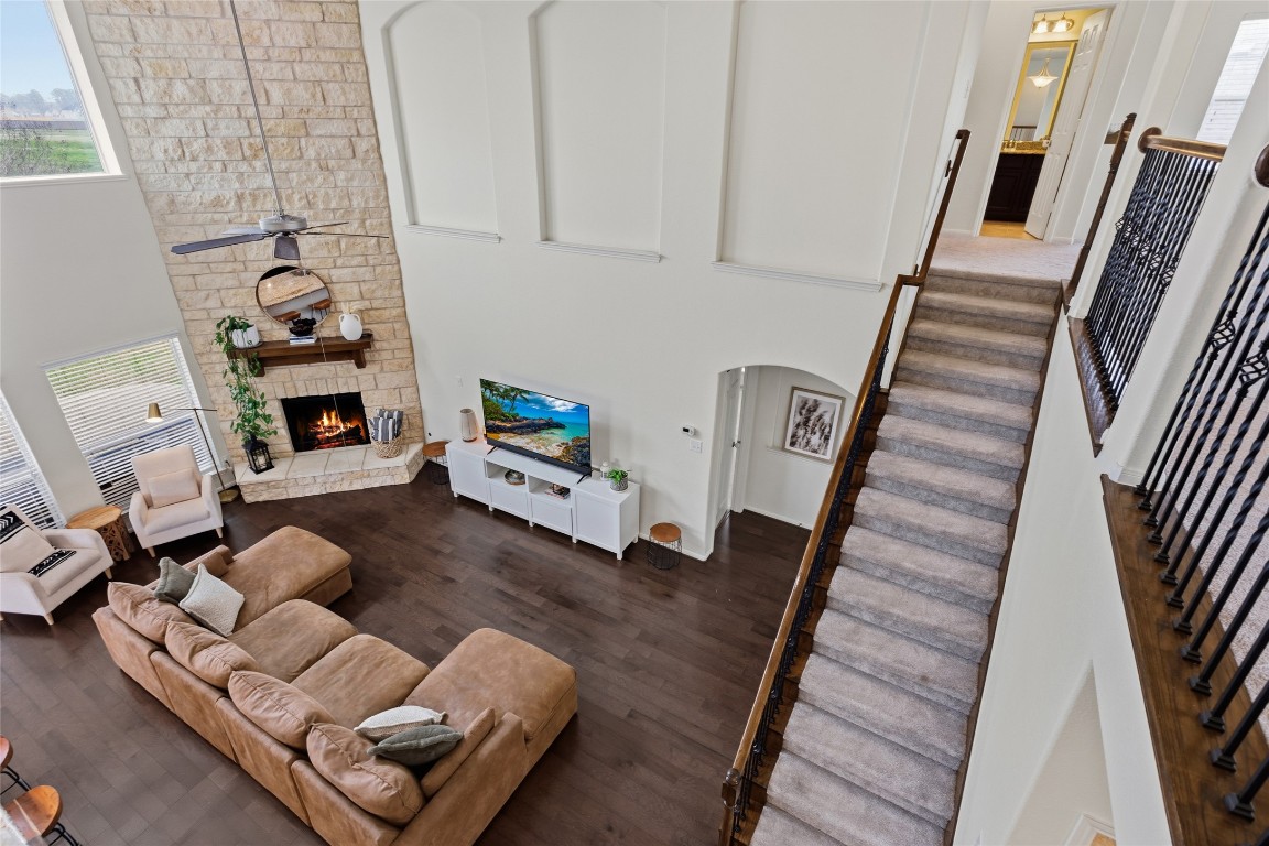 12402 Garnet Road Mont Belvieu, TX 77535 - Photo 26 of 49 a living room with furniture and a fireplace