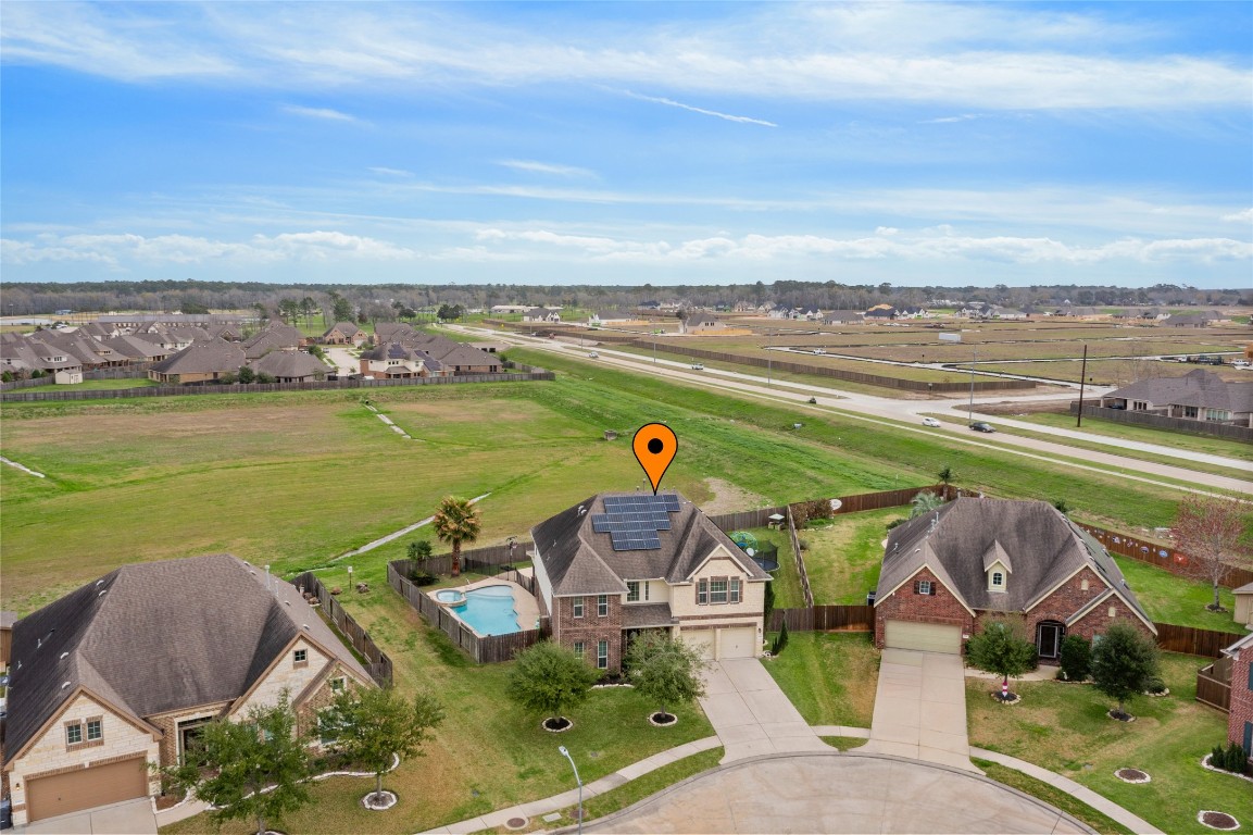 12402 Garnet Road Mont Belvieu, TX 77535 - Photo 3 of 49 an aerial view of a house with outdoor space ocean view