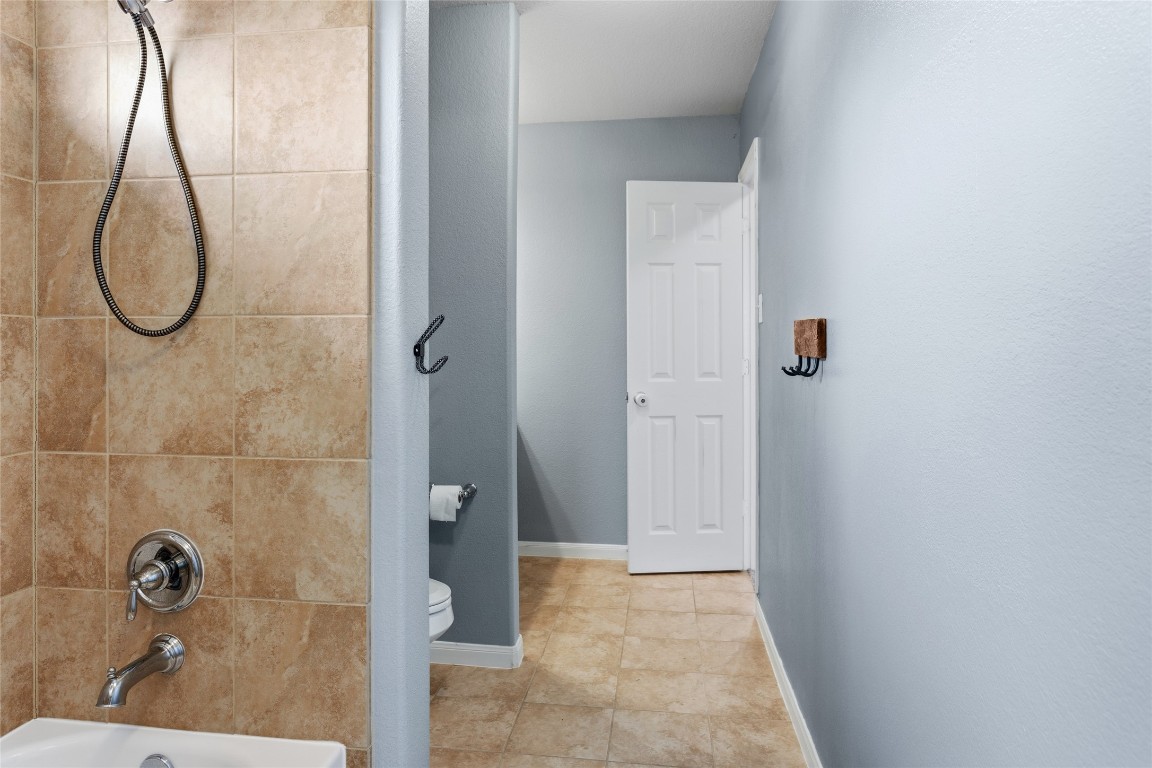 12402 Garnet Road Mont Belvieu, TX 77535 - Photo 32 of 49 a bathroom with a shower