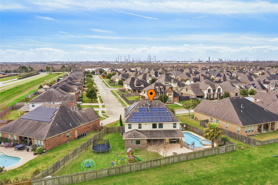 12402 Garnet Road Mont Belvieu, TX 77535 - Photo 46 of 49 an aerial view of residential houses with outdoor space and ocean view