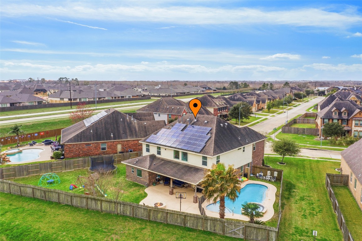 12402 Garnet Road Mont Belvieu, TX 77535 - Photo 49 of 49 an aerial view of residential houses with outdoor space and ocean view