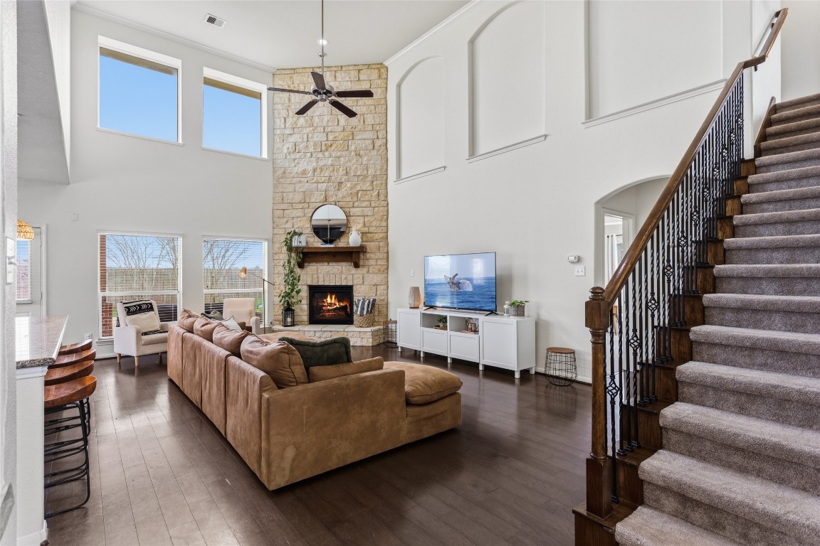 12402 Garnet Road Mont Belvieu, TX 77535 - Photo 7 of 49 a living room with furniture fireplace and wooden floor