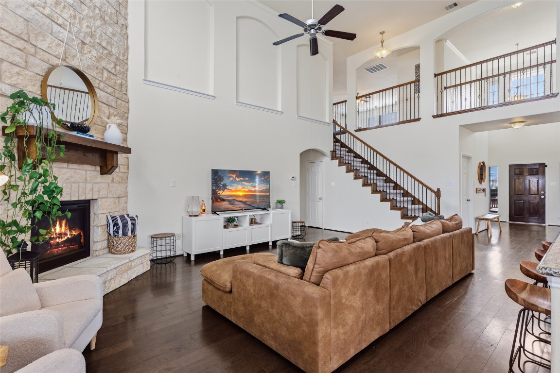 12402 Garnet Road Mont Belvieu, TX 77535 - Photo 8 of 49 a living room with furniture wooden floor and a fireplace