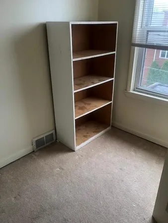 a view of an empty room with a window