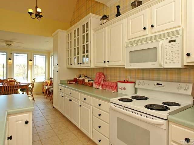 4321 Willow Lake Road Raleigh, NC 27616 - Photo 6 of 12 Tile in Kitchen and Sunroom