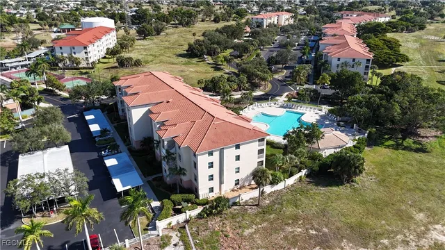a view of a house with a yard and garden