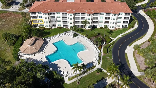 a aerial view of a house with garden space and lake view