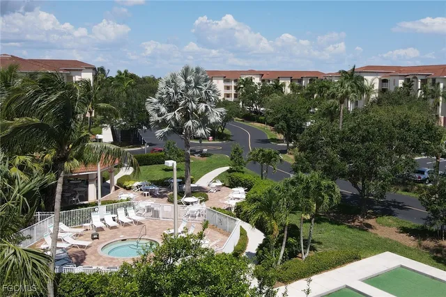 an aerial view of residential house with outdoor space and street view