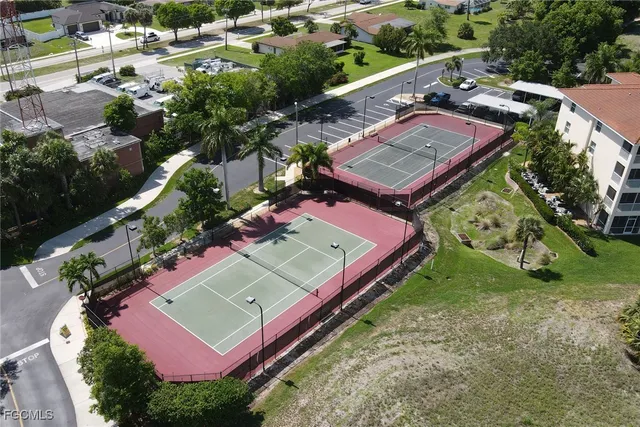 a view of a swimming pool with a patio and a yard