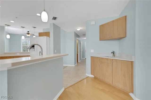 a spacious bathroom with a sink and a mirror