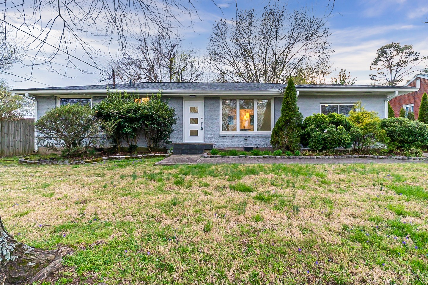 front view of a house with a yard