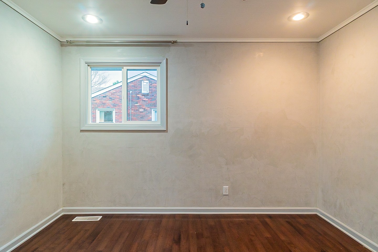 1010 Mitchell Road Nashville, TN 37206 - Photo 16 of 25 a view of an empty room with wooden floor and a window