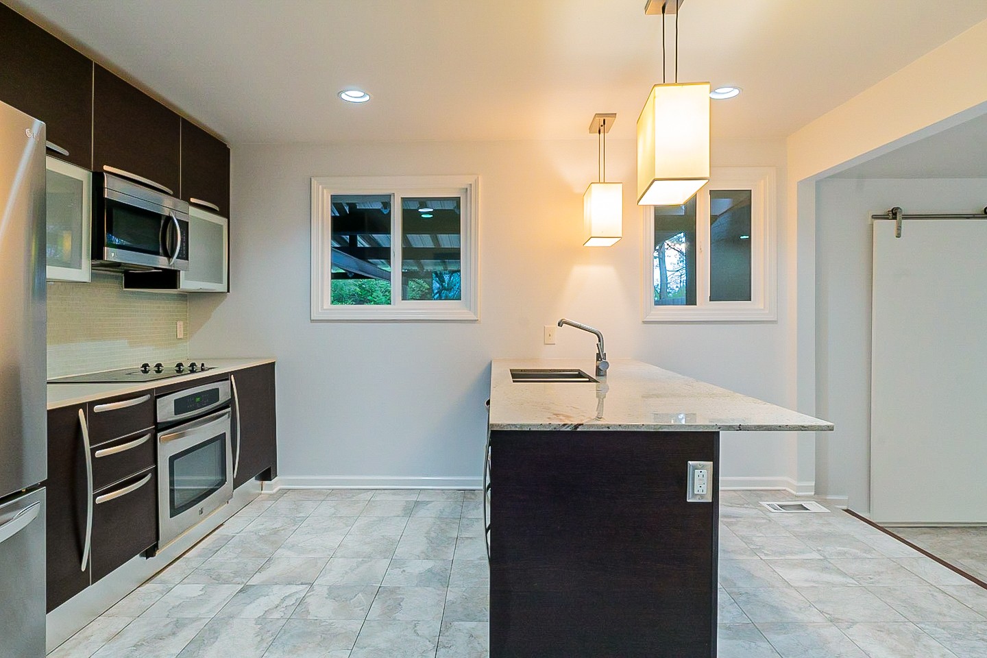 1010 Mitchell Road Nashville, TN 37206 - Photo 4 of 25 a kitchen with stainless steel appliances granite countertop a sink a stove and a refrigerator