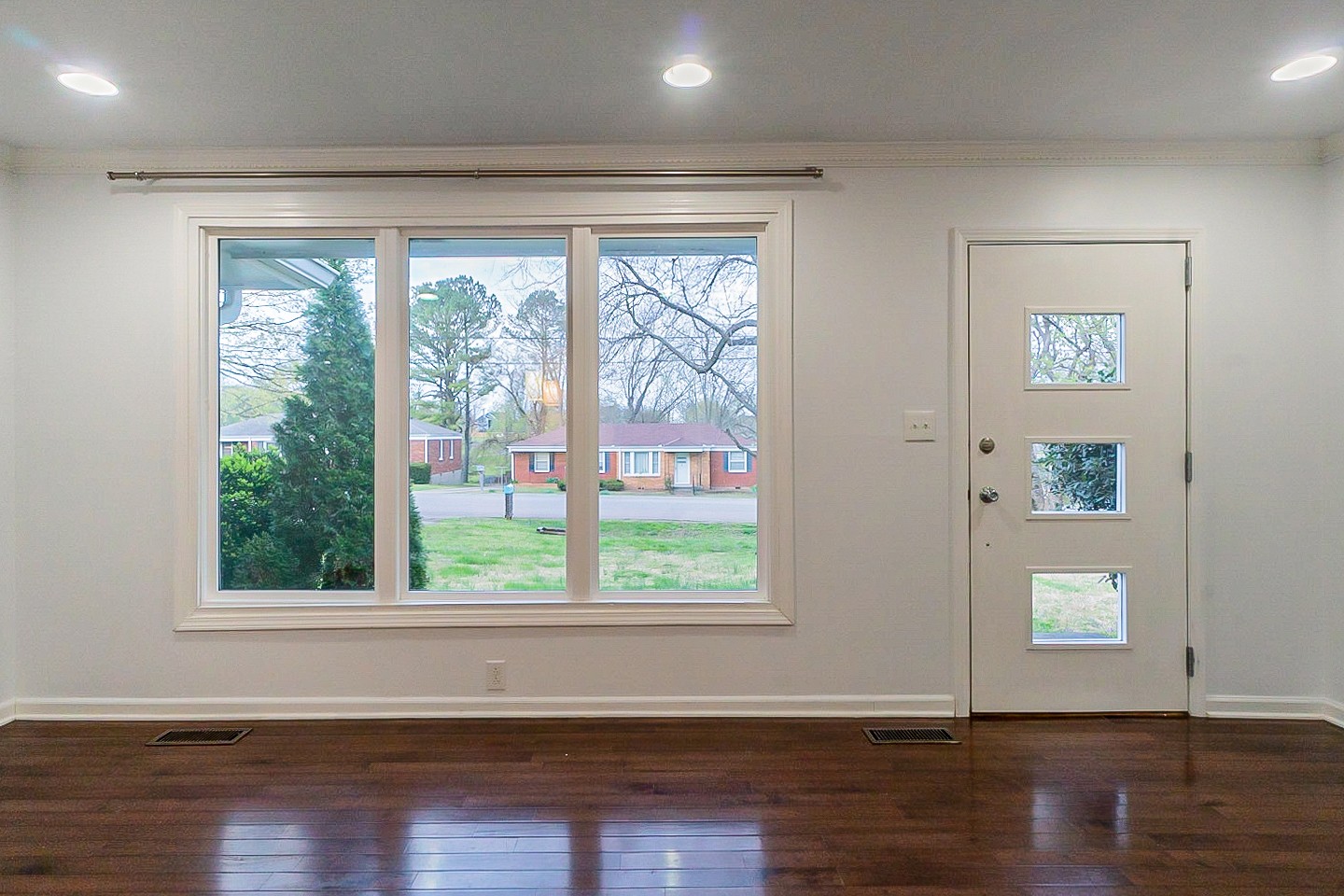 1010 Mitchell Road Nashville, TN 37206 - Photo 5 of 25 a view of a big room with wooden floor and windows