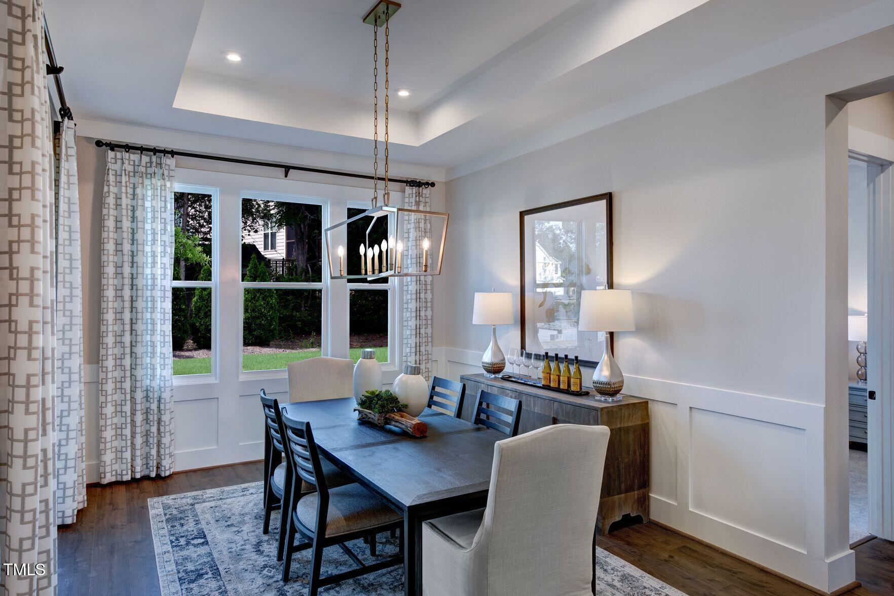 8904 Nicewonder Way Wake Forest, NC 27587 - Photo 22 of 50 a view of a dining room with furniture window and wooden floor