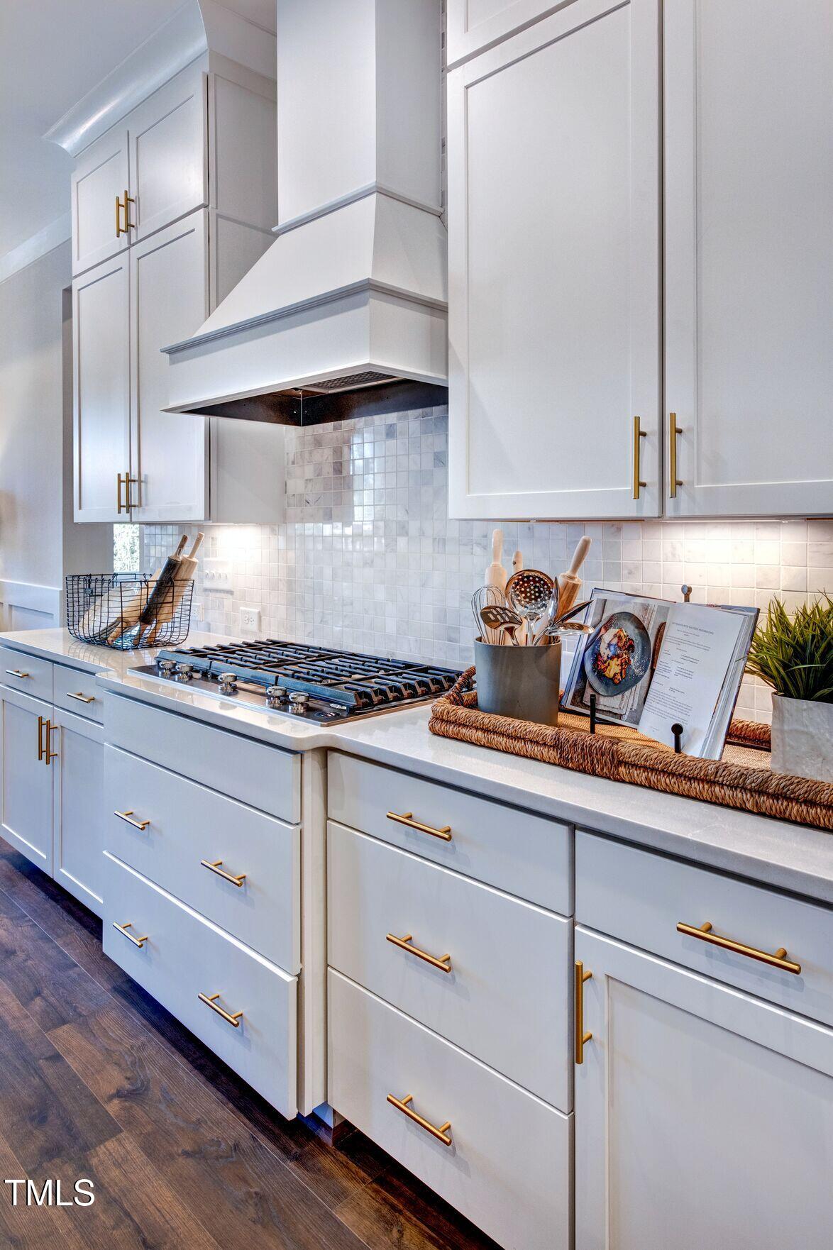 8904 Nicewonder Way Wake Forest, NC 27587 - Photo 33 of 50 a kitchen with granite countertop cabinets and a stove
