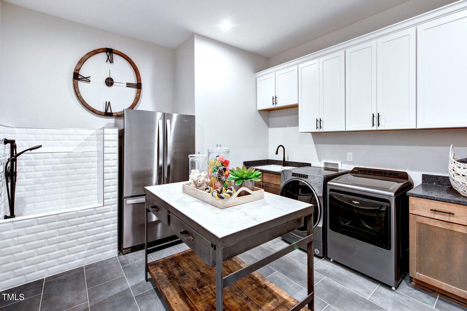 8904 Nicewonder Way Wake Forest, NC 27587 - Photo 40 of 50 a kitchen with a stove a refrigerator a sink and a stove