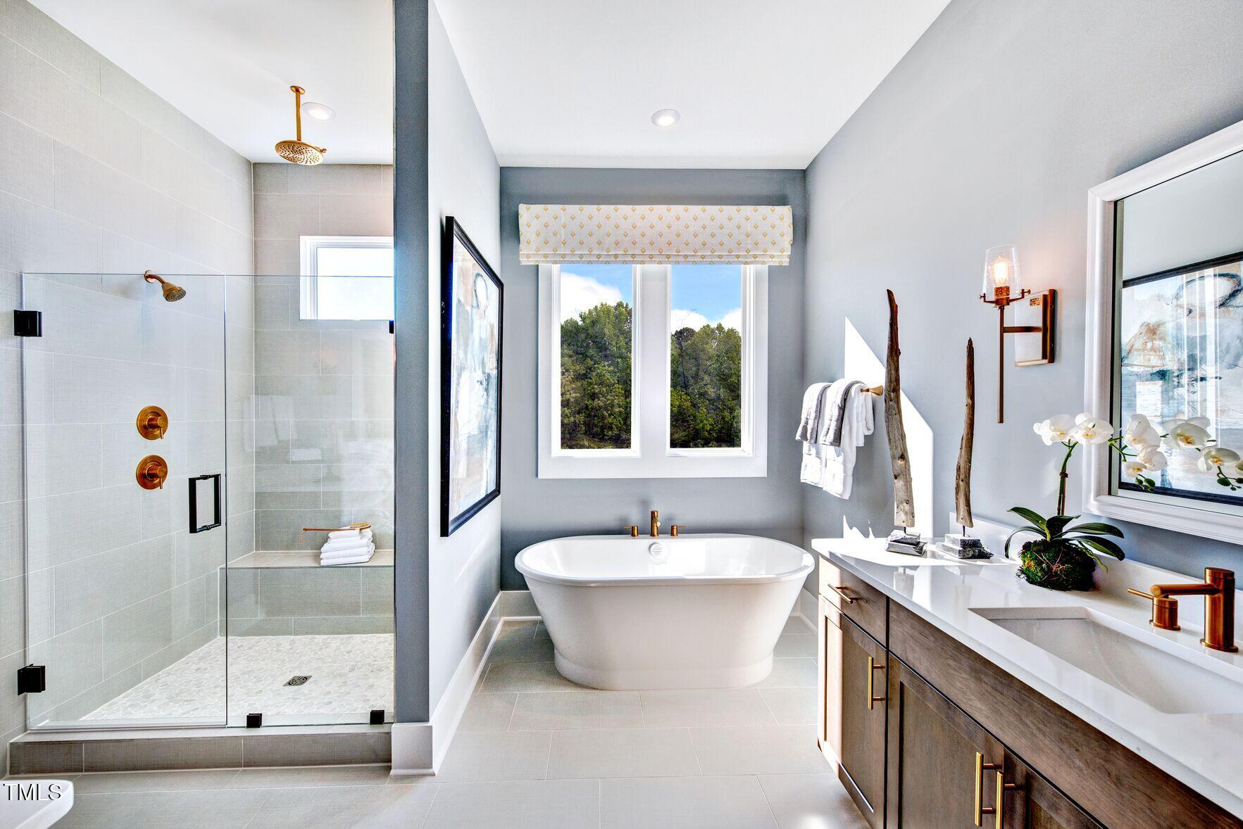 8904 Nicewonder Way Wake Forest, NC 27587 - Photo 5 of 50 a bathroom with a double vanity sink a mirror and a shower