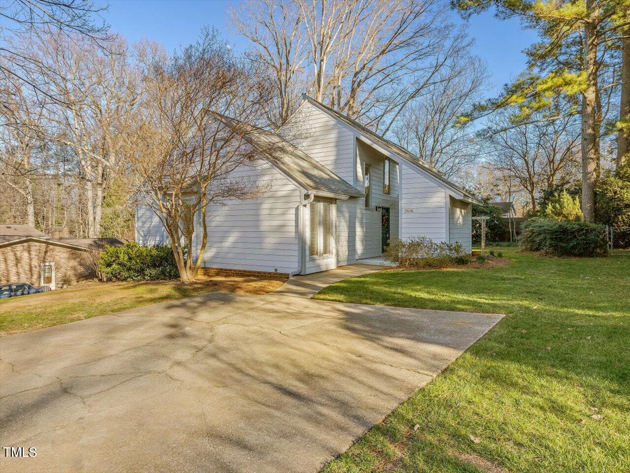 2616 Catalina Drive Raleigh, NC 27607 - Photo 2 of 60 a view of a yard in front of a house