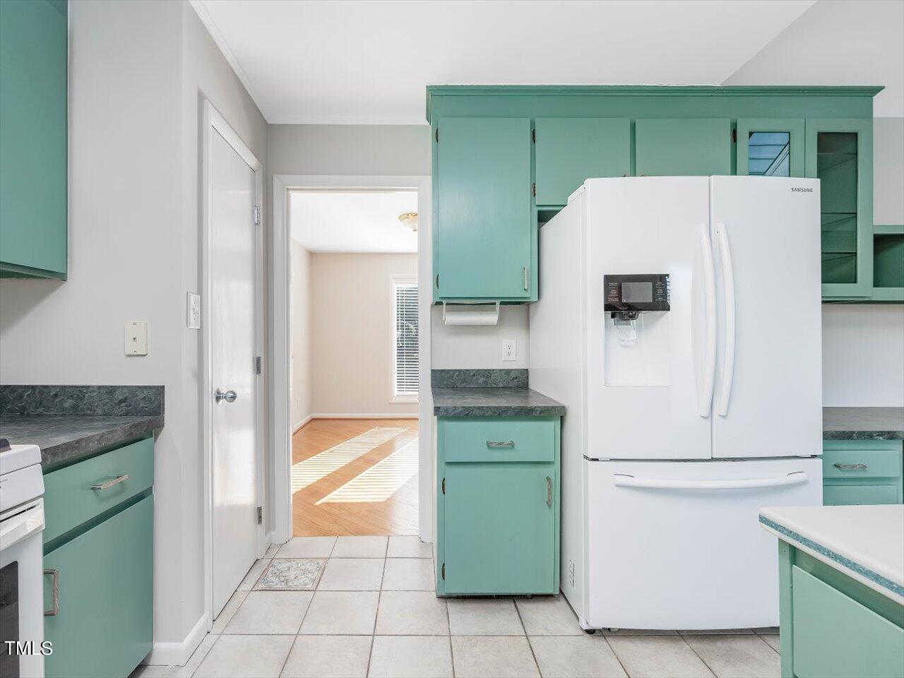 2616 Catalina Drive Raleigh, NC 27607 - Photo 24 of 60 a kitchen with a refrigerator and a stove