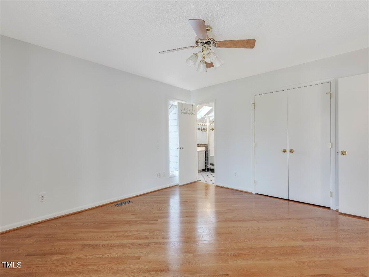 2616 Catalina Drive Raleigh, NC 27607 - Photo 27 of 60 a view of an empty room with a chandelier fan