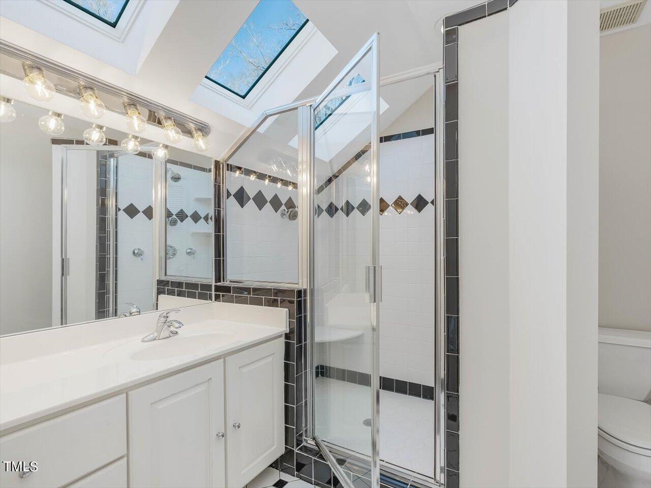 2616 Catalina Drive Raleigh, NC 27607 - Photo 28 of 60 a bathroom with a sink and a mirror