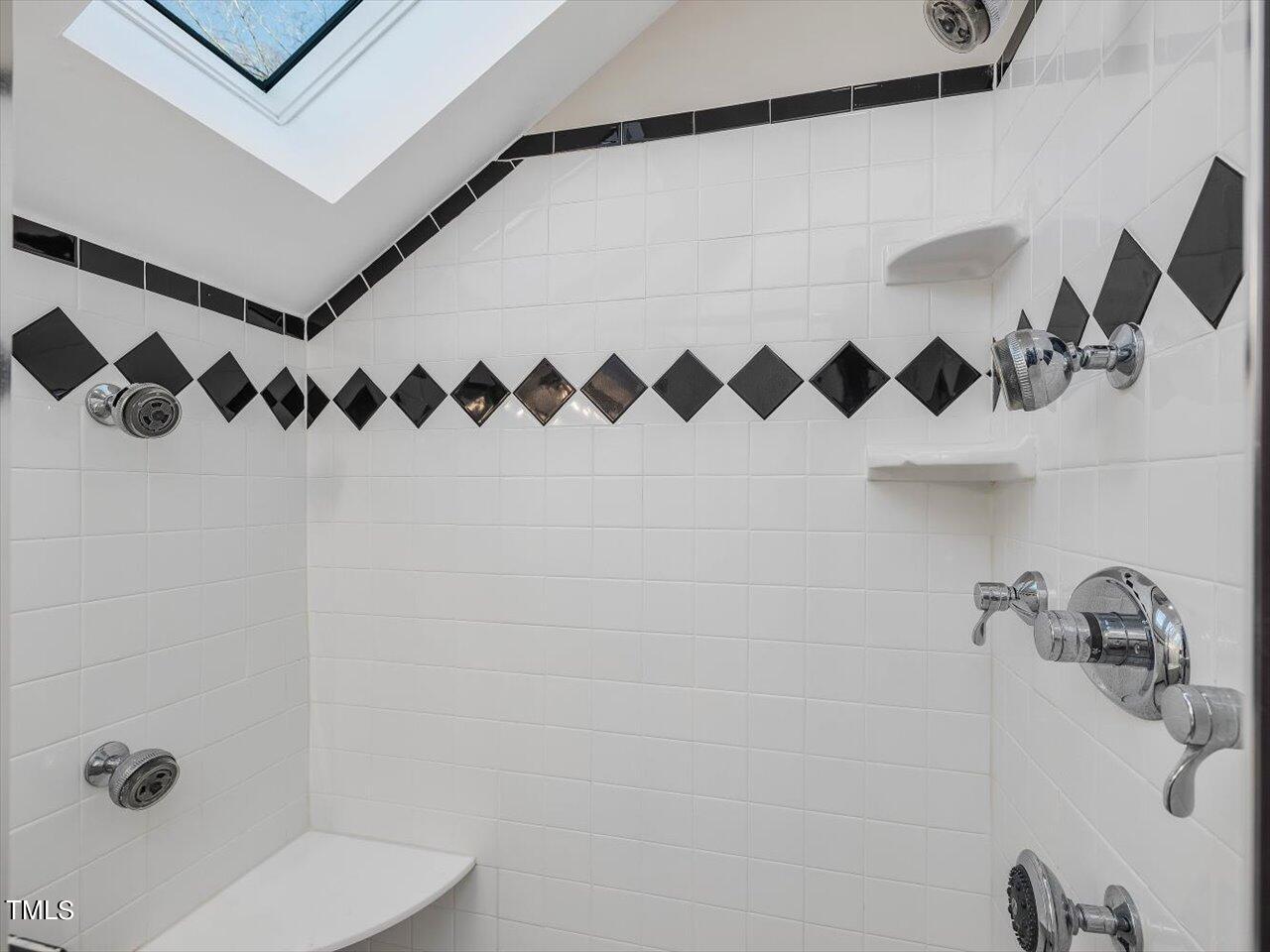 2616 Catalina Drive Raleigh, NC 27607 - Photo 29 of 60 a bathroom with a shower and a sink