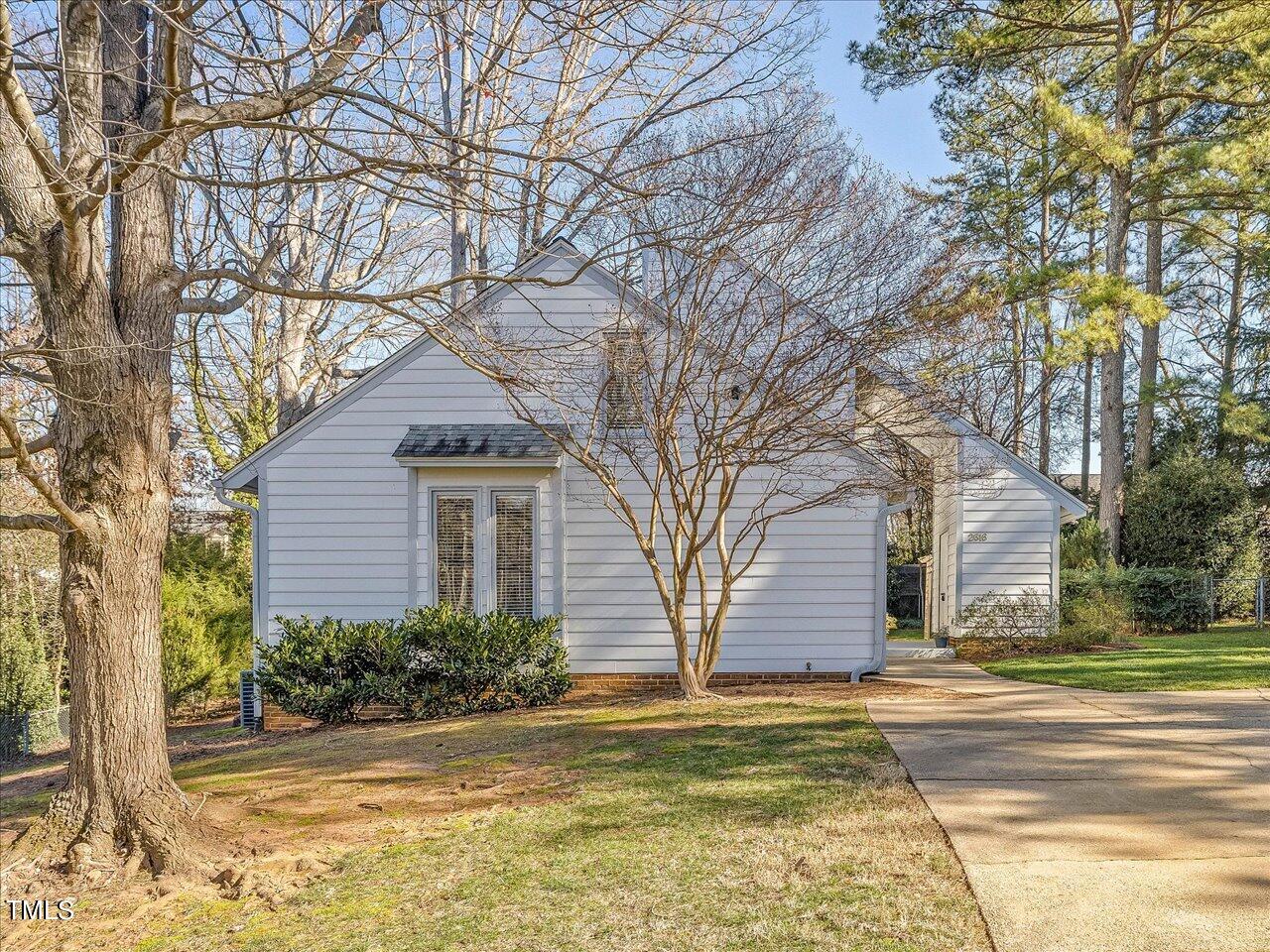 2616 Catalina Drive Raleigh, NC 27607 - Photo 3 of 60 a front view of a house with a yard