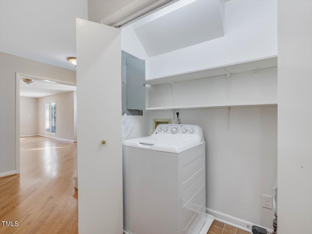 2616 Catalina Drive Raleigh, NC 27607 - Photo 33 of 60 a utility room with cabinets washer and dryer