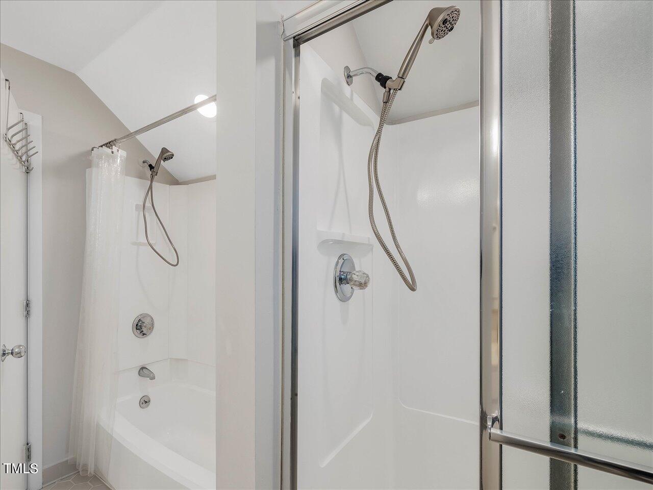 2616 Catalina Drive Raleigh, NC 27607 - Photo 40 of 60 a bathroom with a glass shower door