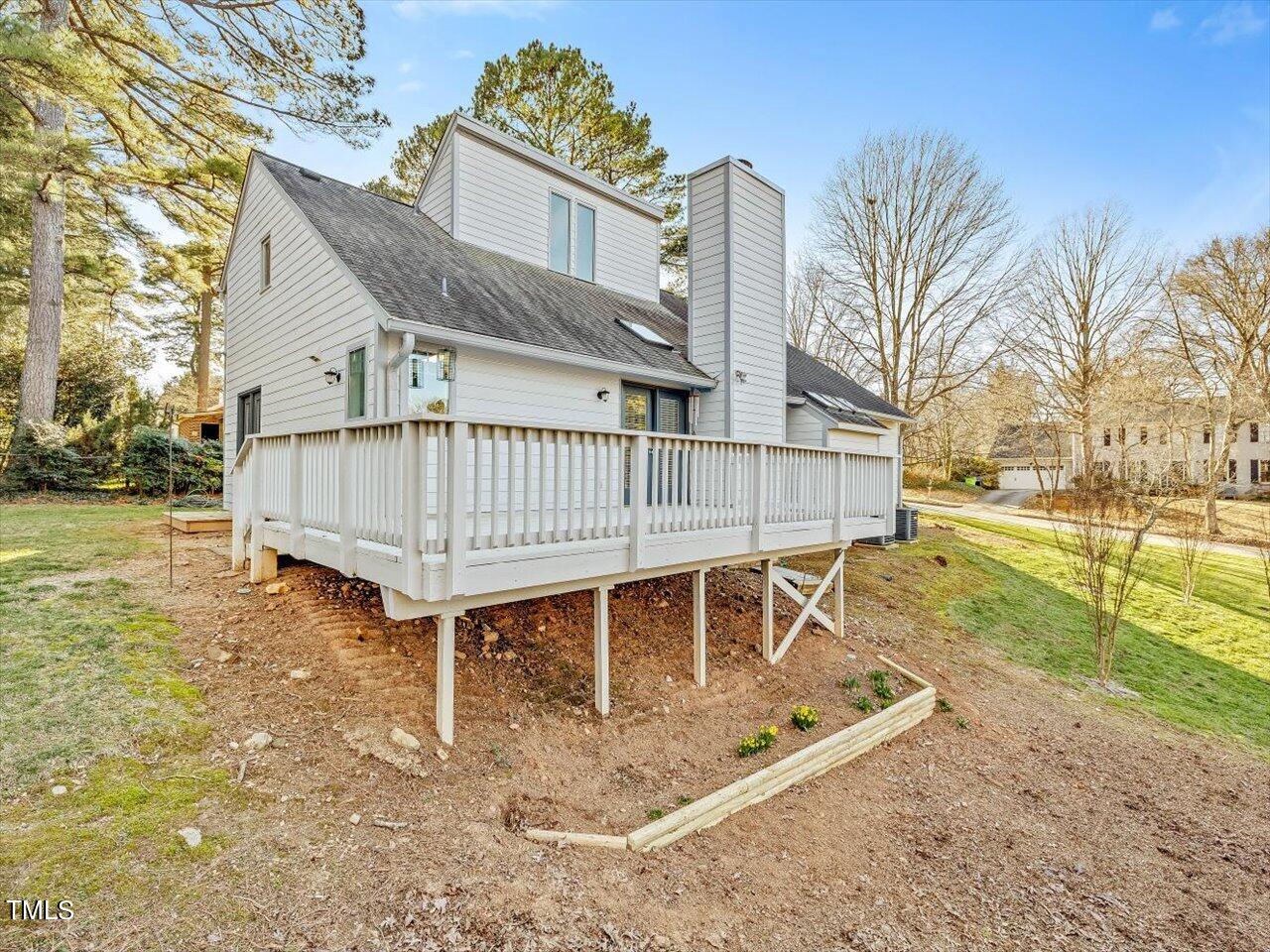 2616 Catalina Drive Raleigh, NC 27607 - Photo 55 of 60 a view of a house with backyard and a garden