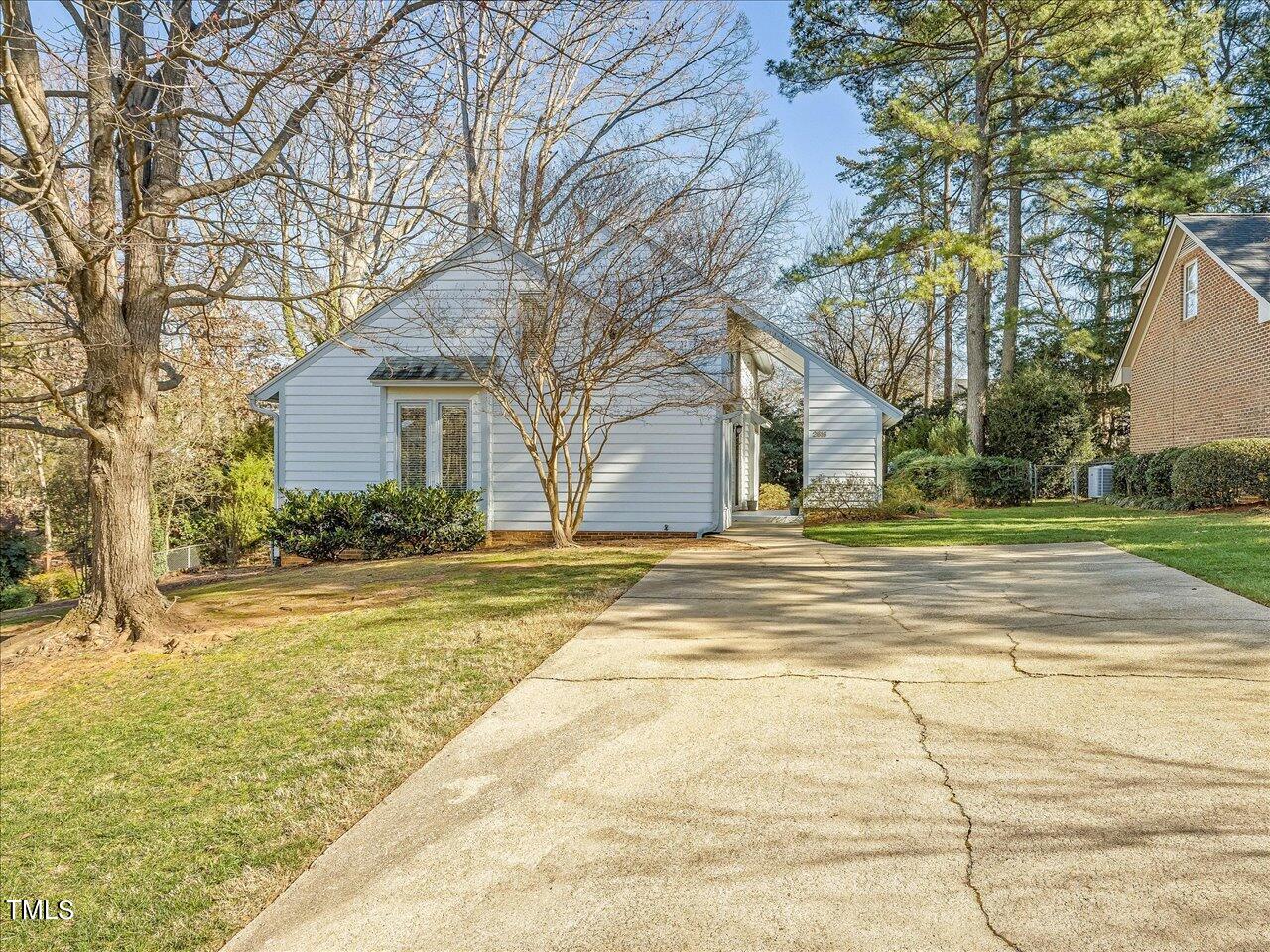 2616 Catalina Drive Raleigh, NC 27607 - Photo 58 of 60 a view of a house with snow on the tree