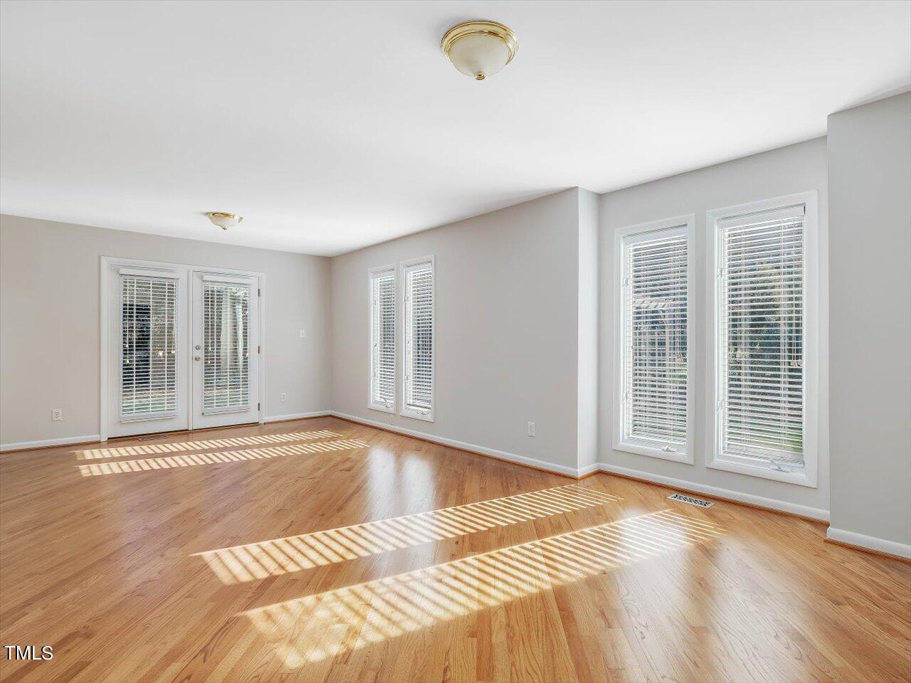 2616 Catalina Drive Raleigh, NC 27607 - Photo 10 of 60 a view of a livingroom with wooden floor and a window